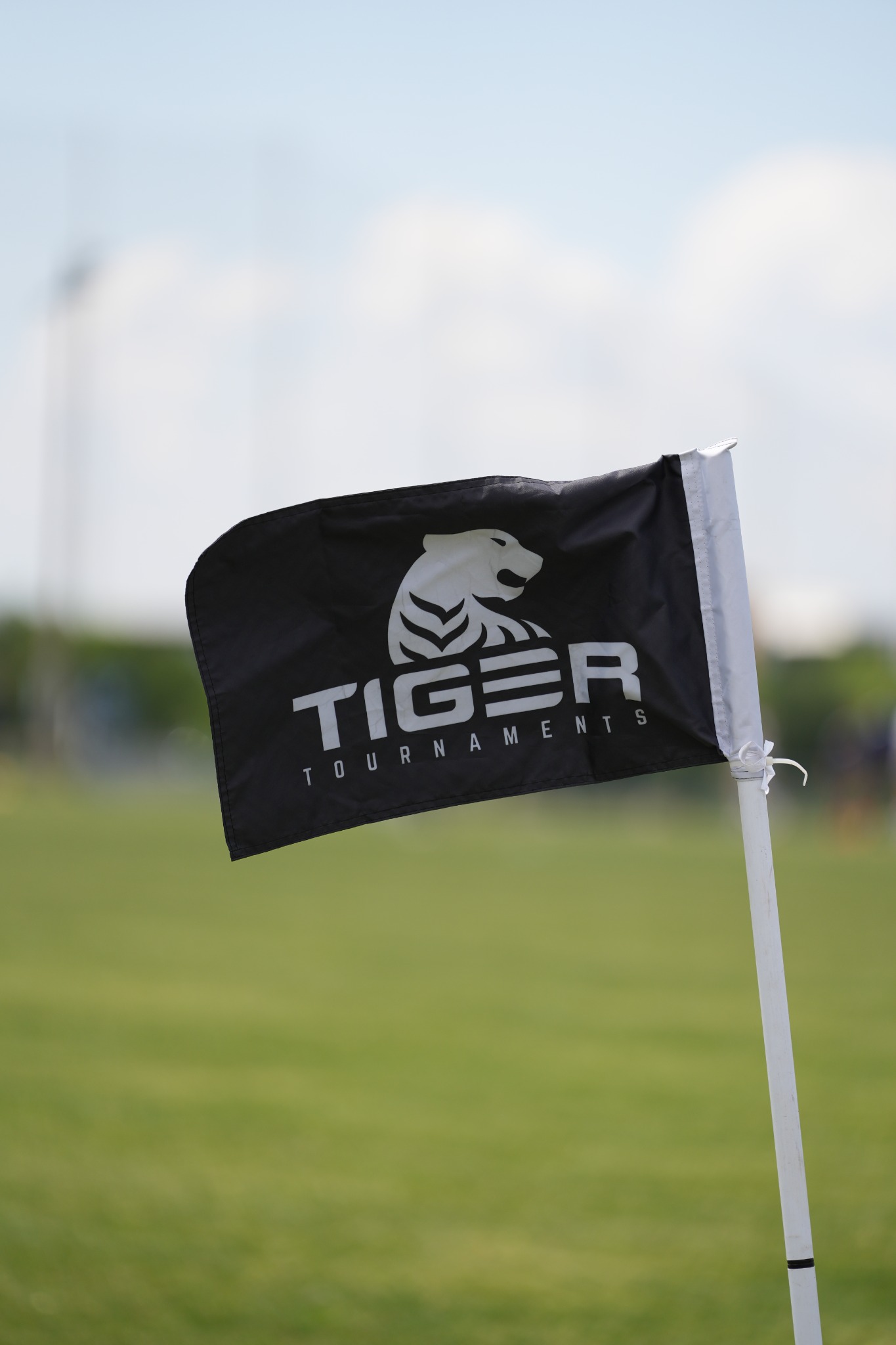 Black Tiger corner flag and white pole installed on a soccer field