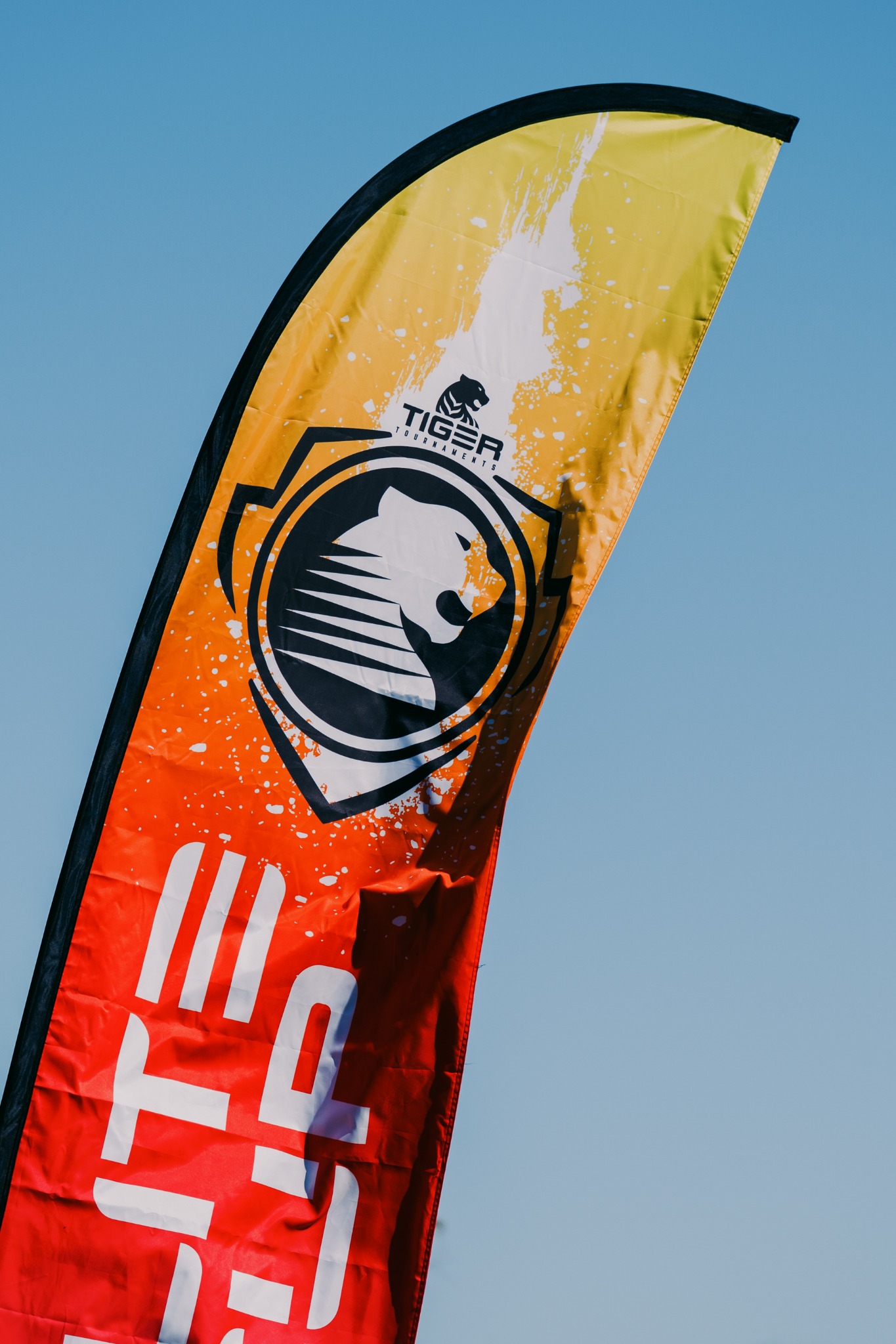 Yellow and orange Elite Cup feather flag showing Tiger artwork