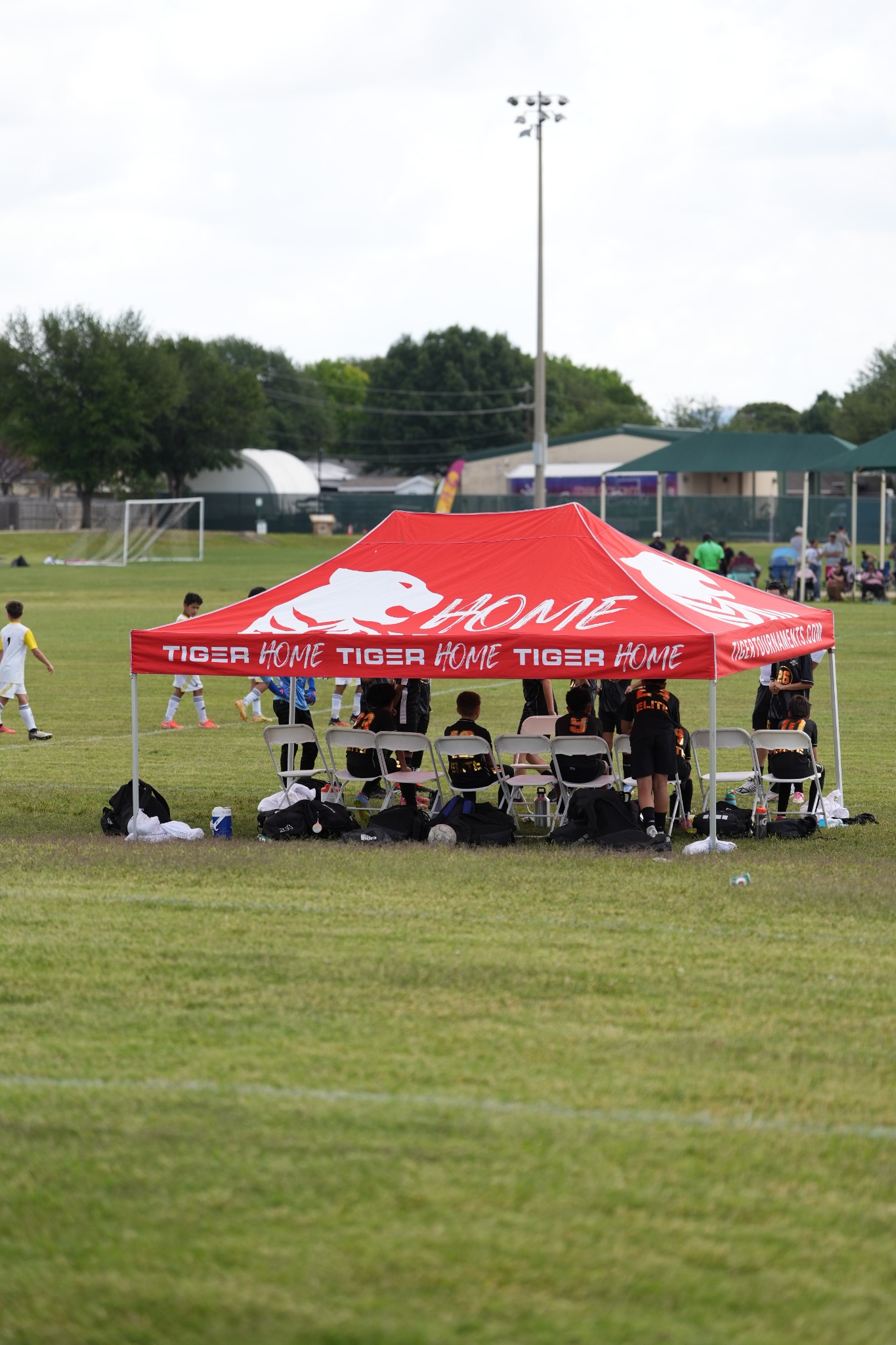Red Tiger team canopy photographed from the front on a soccer field